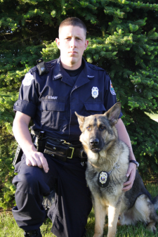 A police officer and a K9 dog. 