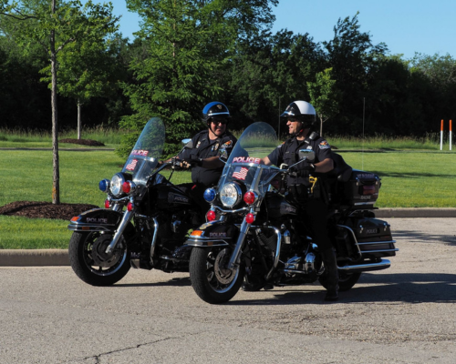 Two police officers riding motorcycles. 